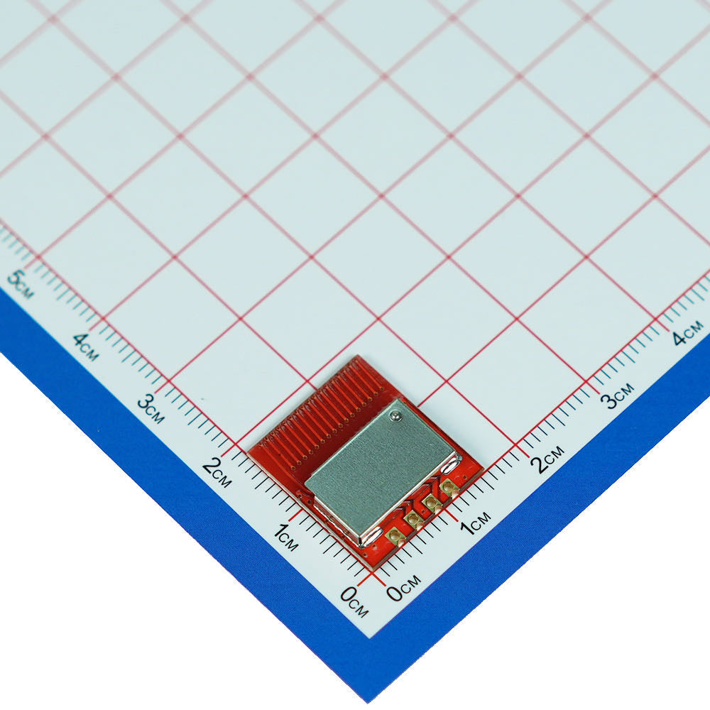 Yuan-T4A transmitter module photographed against a centimeter scale
